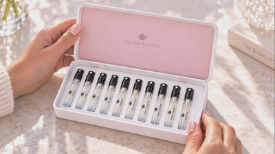 Hands opening the Lili Bermuda Fragrance Library with ten perfume samples.